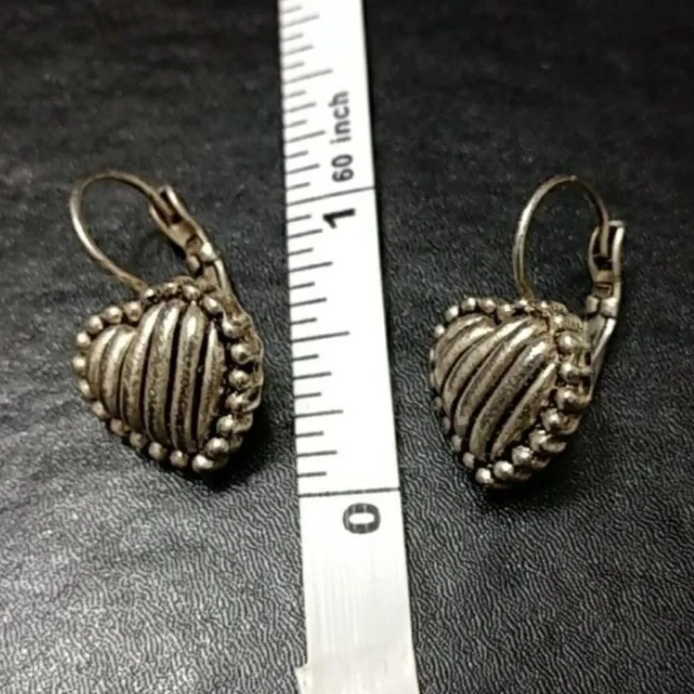 Silver tone heart earrings textured dangling